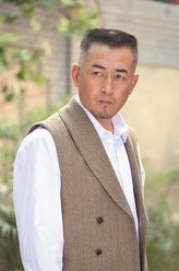 田子行（王志飞饰演）