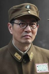 贺国光（姚刚饰演）