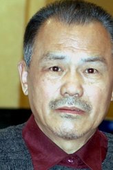 袁成贵（李万年饰演）
