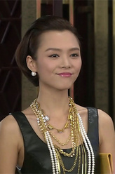 唐明娜（程怡饰演）